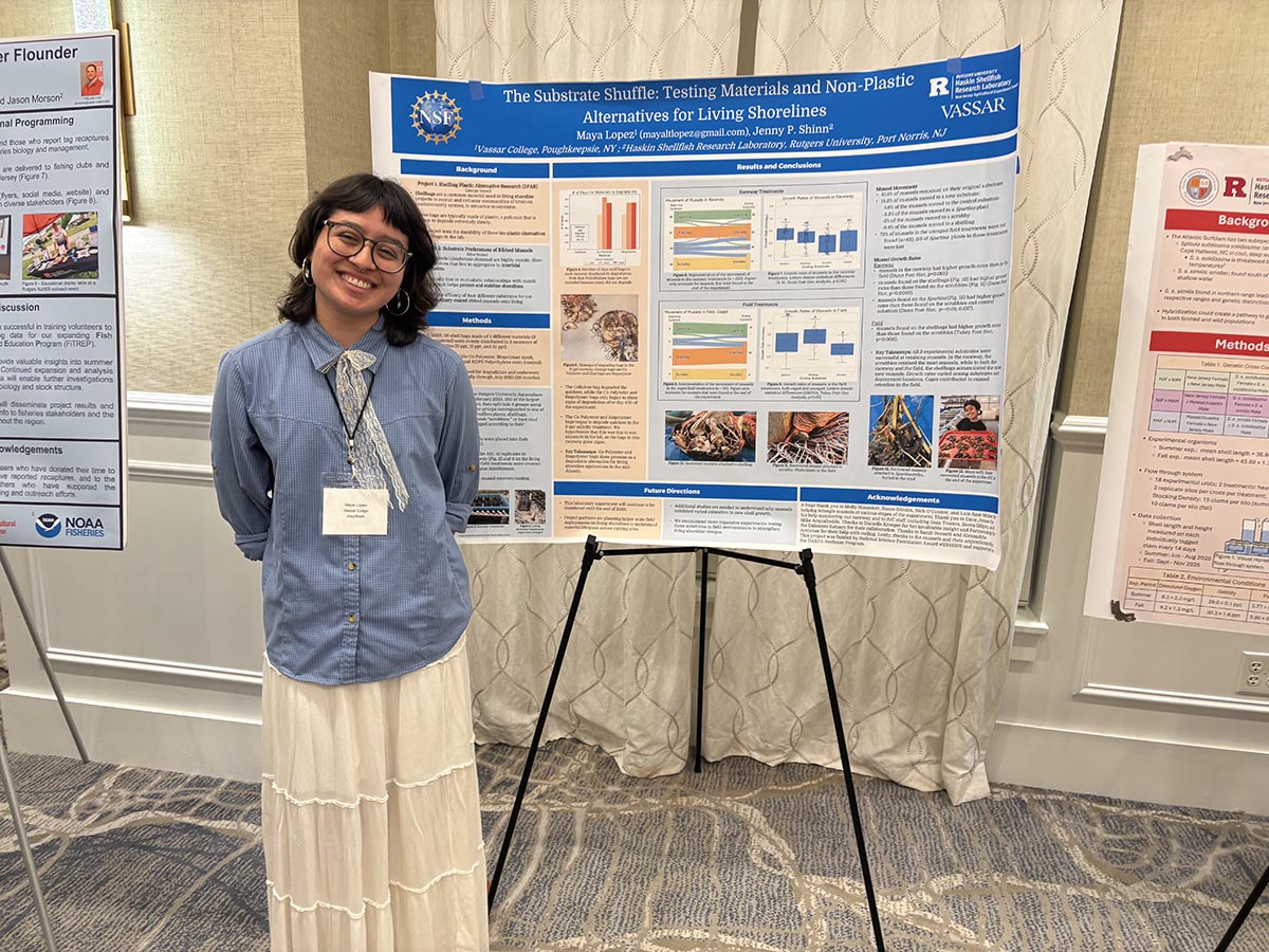 Image shows student presenters at conference receiving awards.